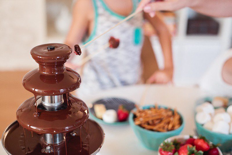 Kid Friendly Fondue Party - Just two simple ingredients gives you deliciously smooth chocolate fondue for your next party or after school snack and serve with your favorite snacks for a kid friendly fondue (fountain not required, but it is totally fun right?!)