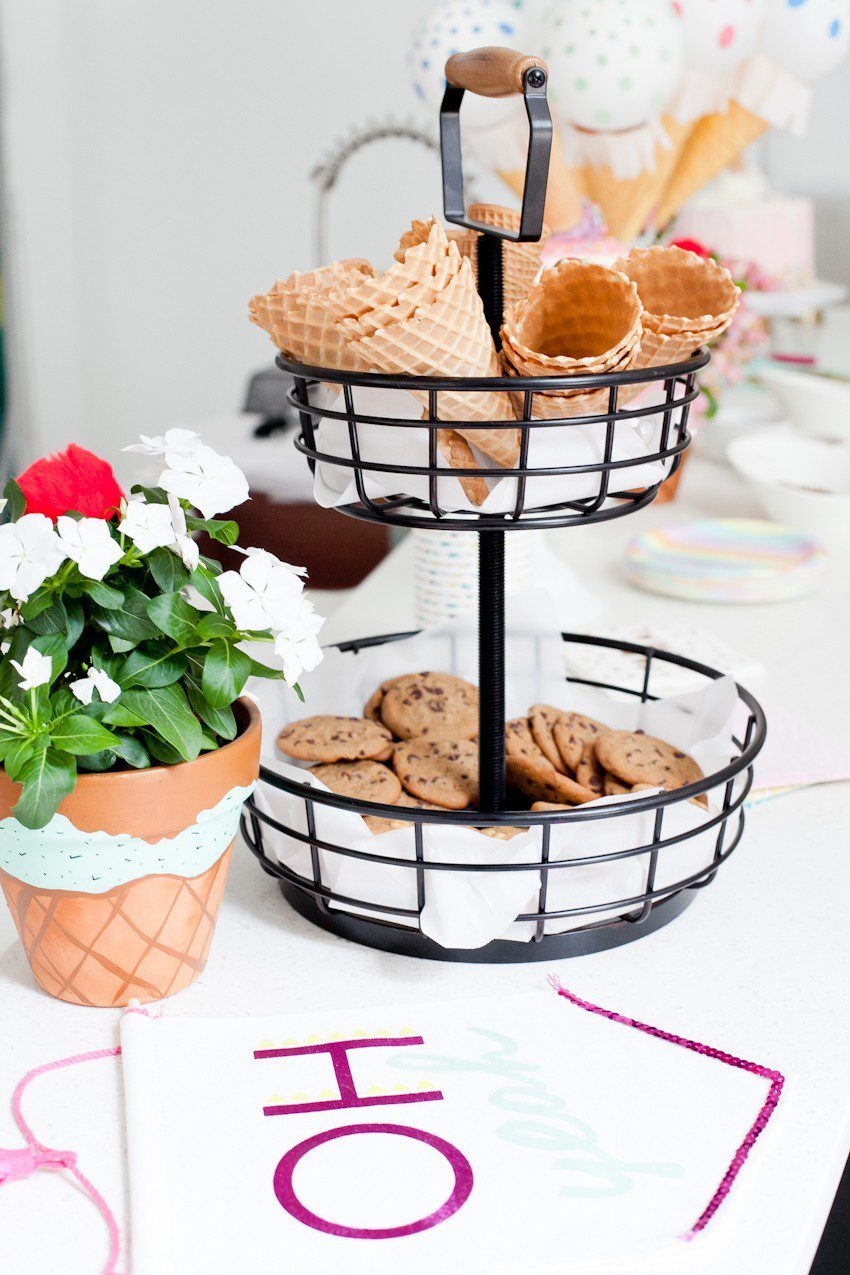 Ice Cream Social Birthday Party with DIY Ice Cream Balloons, and ice cream cone "spilled" cake, Ice Cream bar with cookies for DIY ice cream cookies and more! So much sweetness for a sweet first birthday party!