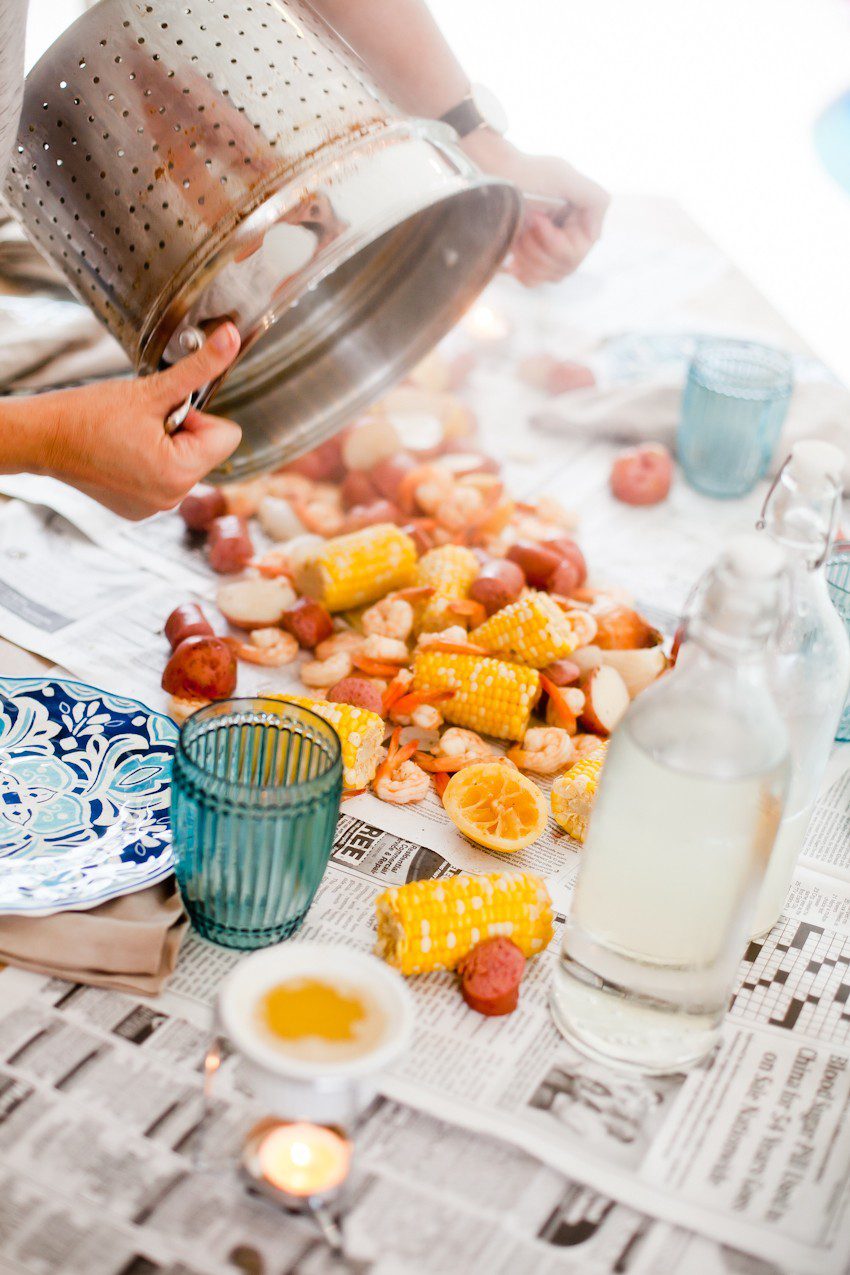 How to host a seafood boil for easy summer entertaining! Think a seafood boil seems like a lot of effort to pull off? We did too... until our first one! Read on for our simple tips to create your own summer seafood affair.
