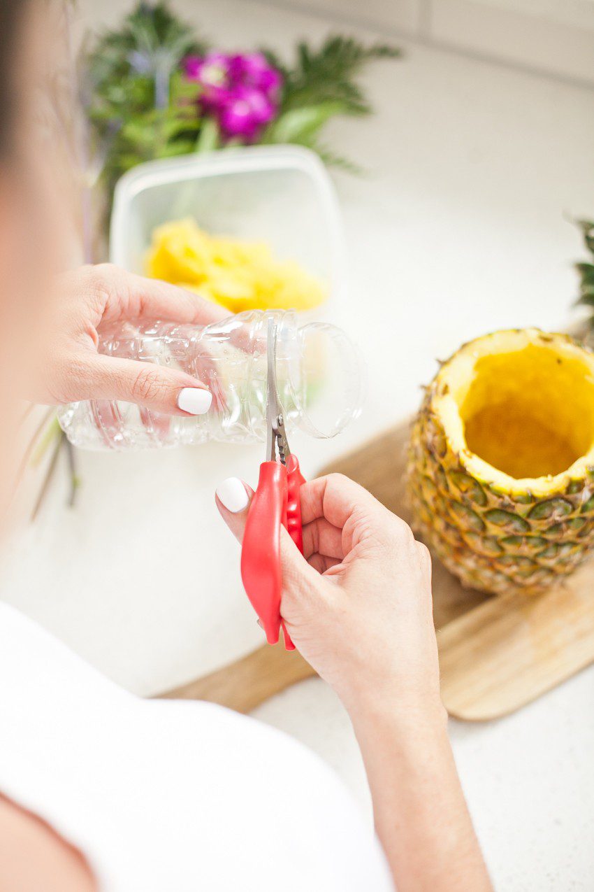 Pineapple Flower Arrangement for garden parties or a summer tropical fete! This DIY Pineapple vase is an easy to make centerpiece or perfect for a Tiki bar!
