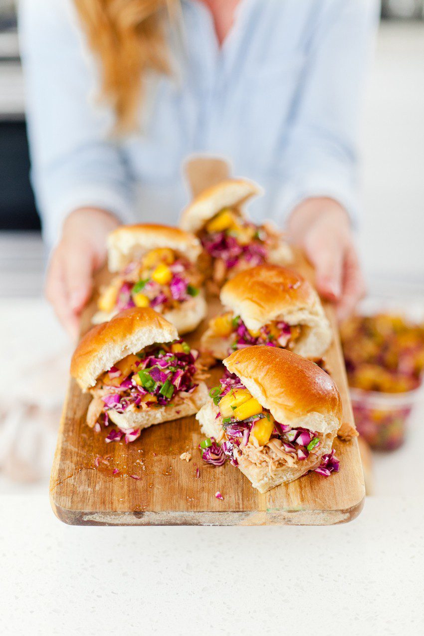Easy Entertaining and BBQ Hawaiian Chicken Sliders recipe with pineapple mango slaw. Great summer backyard barbecue ideas featured by popular Florida foodie blogger and lifestyle blogger Tabitha Blue of Fresh Mommy Blog