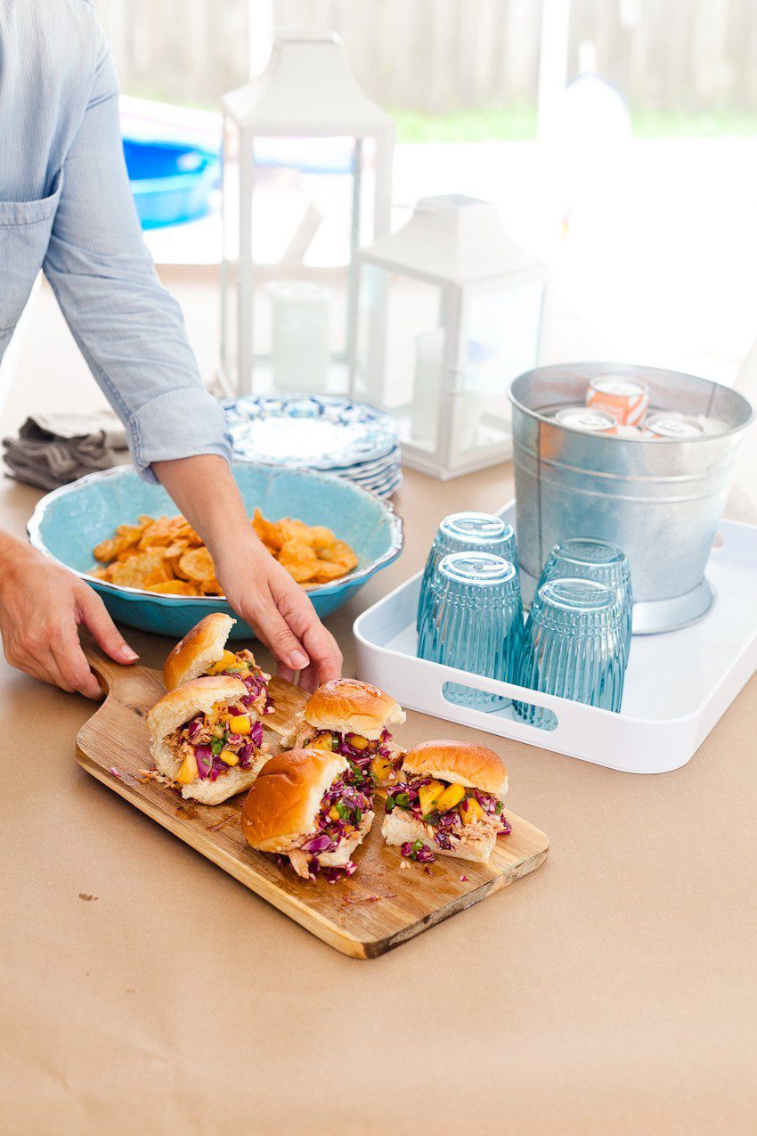 Easy Entertaining and BBQ Hawaiian Chicken Sliders recipe with pineapple mango slaw. Great summer backyard barbecue ideas featured by popular Florida foodie blogger and lifestyle blogger Tabitha Blue of Fresh Mommy Blog