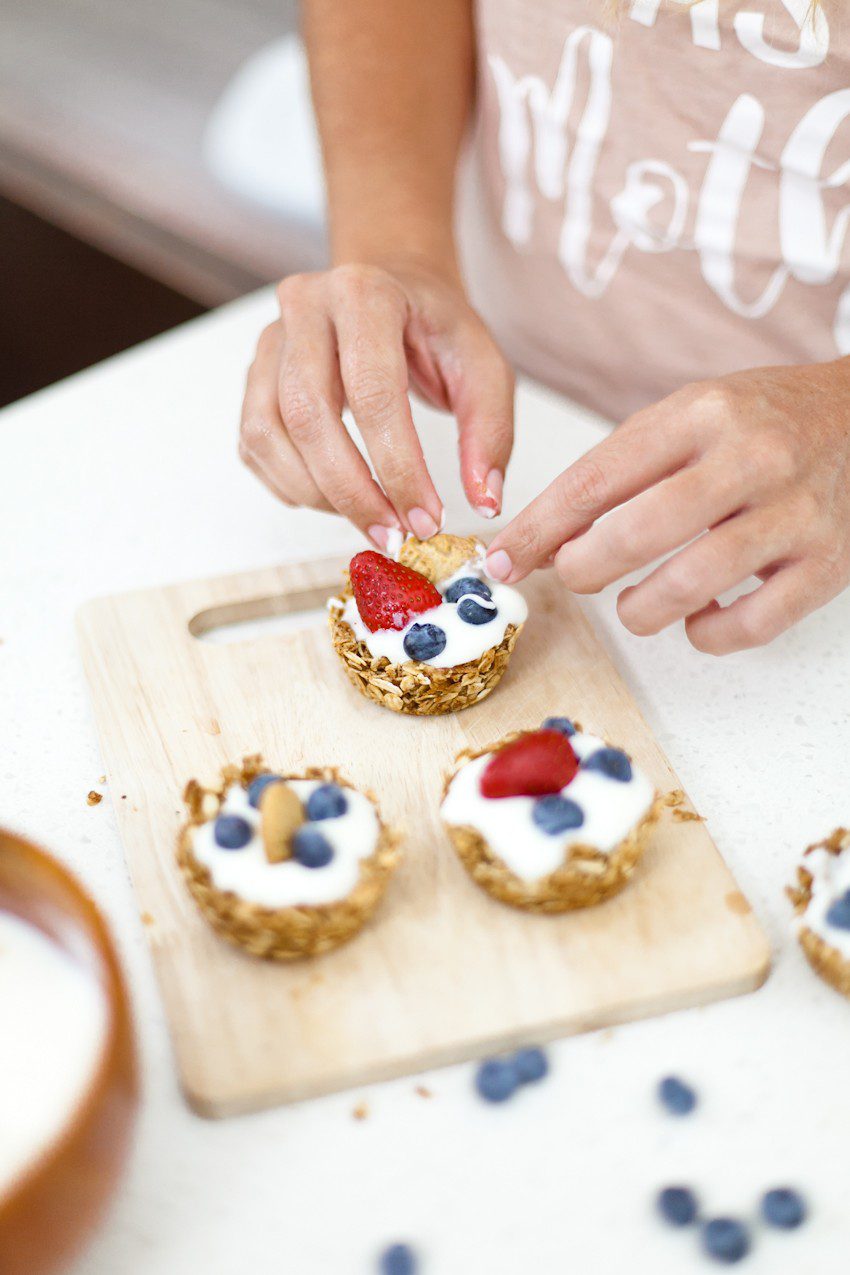 A parfait-style treat with a twist! Sweet, delicious, and crunchy granola cups exploding with flavor to hold all the goodies of a delicious parfait treat. Make these yogurt filled granola cups topped with fruit for breakfast, snacks or even serve as a dessert!