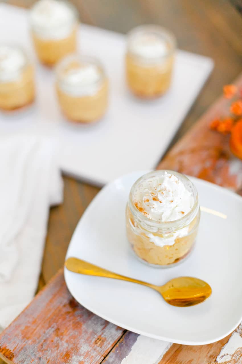 The best No Bake Pumpkin Cheesecake combines some of the favorite flavors of fall! Serve it in jars for an easy individual serving! Perfect for desserts, parties, fall events and more. 