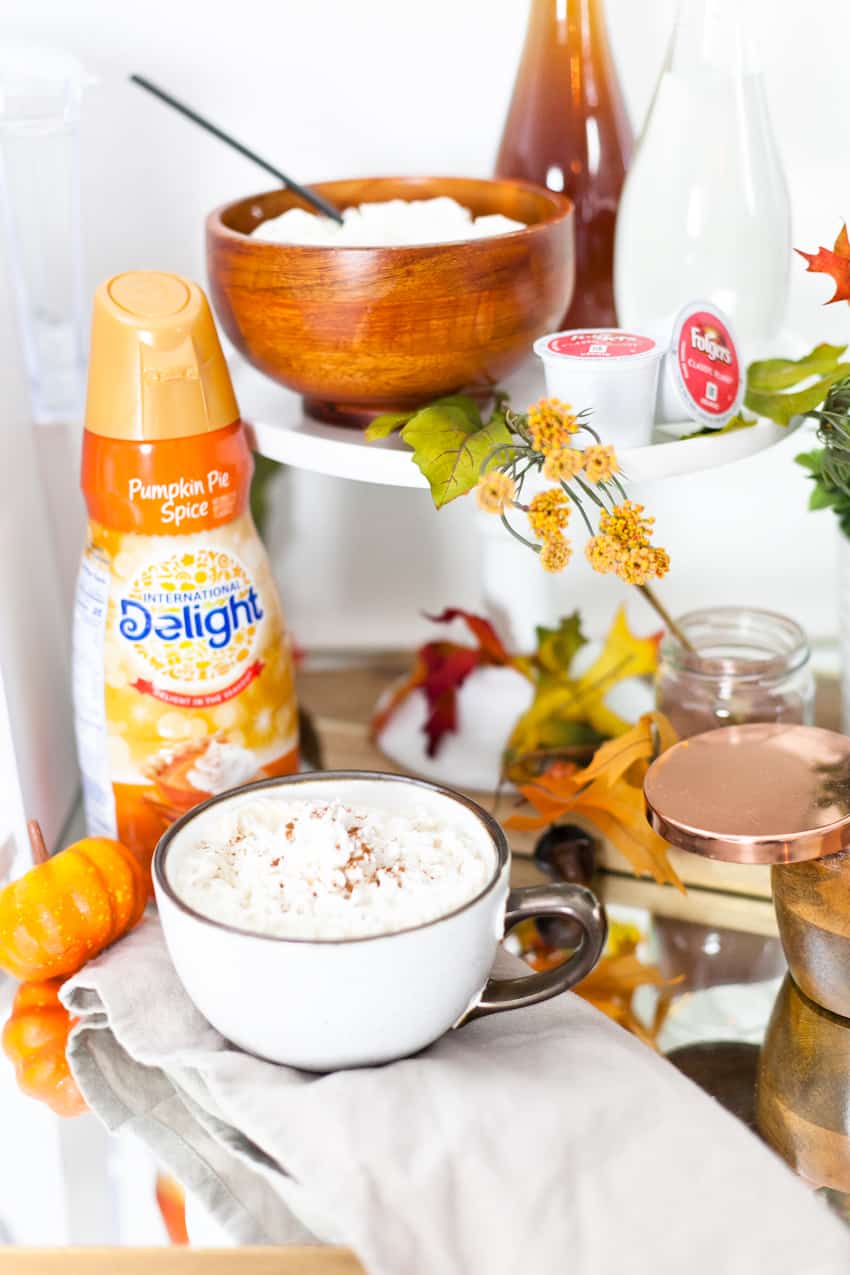 Easy at-home pumpkin pie spice latte recipe in this fall styled coffee bar cart and waffle brunch. 