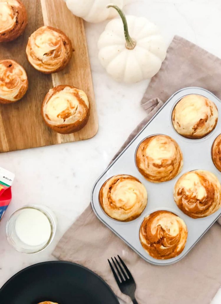 Enjoy the seasonal fall flavors with this quick and easy way to get breakfast on the table with our Pumpkin Cream Cheese Muffins! Moist, spiced pumpkin muffins with a swirl of sweet cream cheese to fuel up for the day... or anytime!