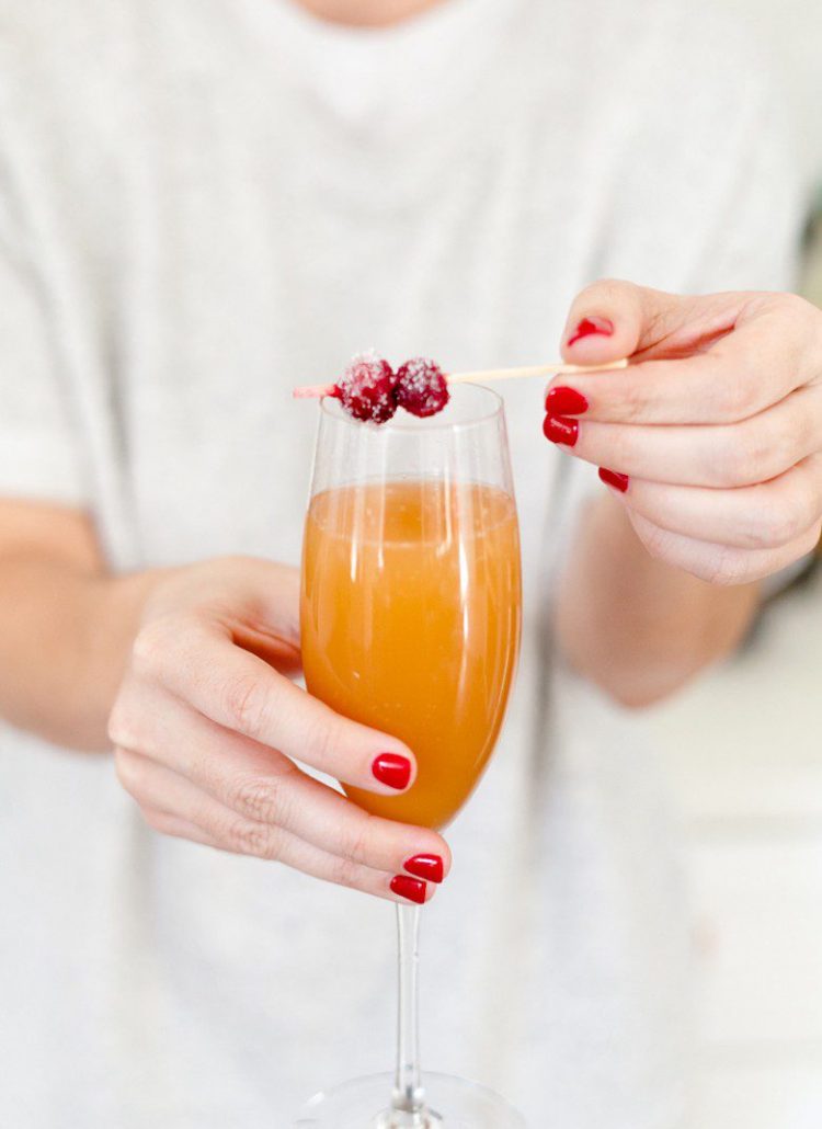 A mimosa bar makes a perfect addition to breakfast or brunch, and makes it easy on the hostess as guests can happily serve themselves. Just a small tweak makes it family-friendly, plus we're showing how to make beautiful sugared cranberries for the perfect holiday topper! 