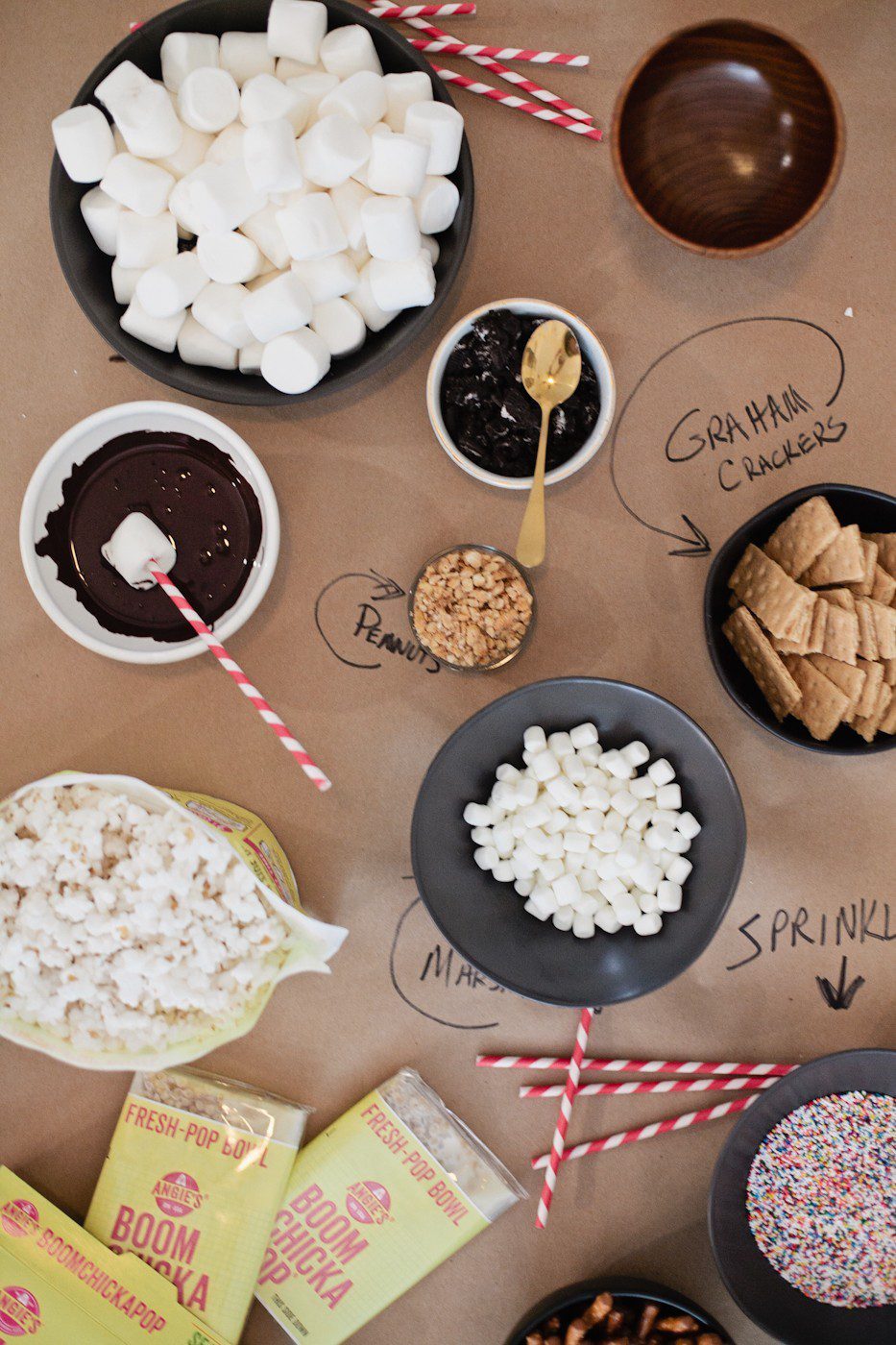 The Best Sleepover Party Snacks: Snacking Table with Popcorn and more featured by top Florida lifestyle blog, Fresh Mommy Blog