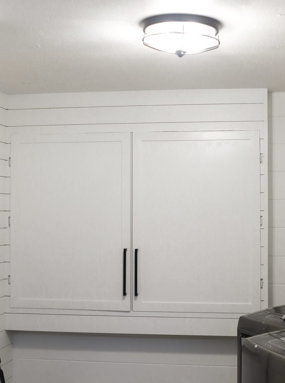 DIY for Covering Breaker Boxes: A Faux Cabinet Tutorial by popular Florida DIY blog, Fresh Mommy: image of DIY cabinets surrounded by shiplap. 