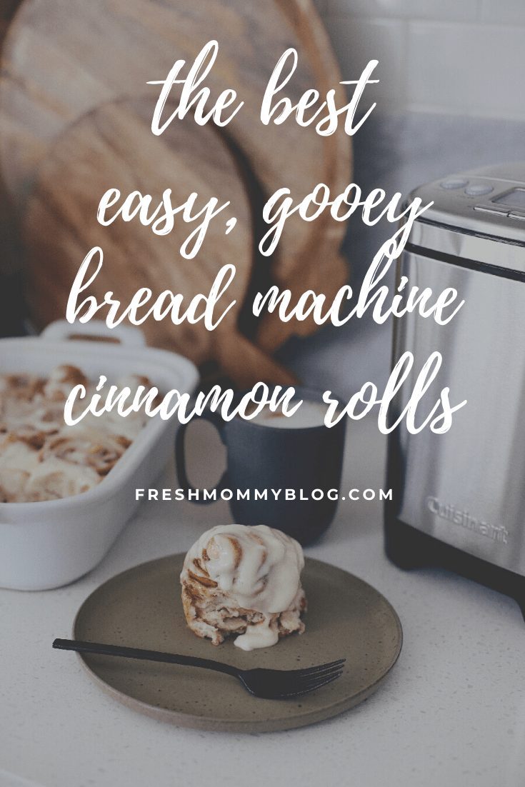 Easy bread machine cinnamon rolls dough. The best gooey sticky buns and clone of a Cinnabon roll icing! NO waiting overnight. Click for the recipe and how to video for fluffy cinnamon rolls homemade with a bread maker machine! Use all purpose flour or make them gluten free. Recipe from top Florida lifestyle blogger Tabitha Blue of Fresh Mommy Blog. | Bread Machine Cinnamon Roll Recipe by popular Florida lifestyle blog, Fresh Mommy Blog: Pinterest image of cinnamon rolls in a white ceramic baking dish next to a bowl of cream cheese icing. 