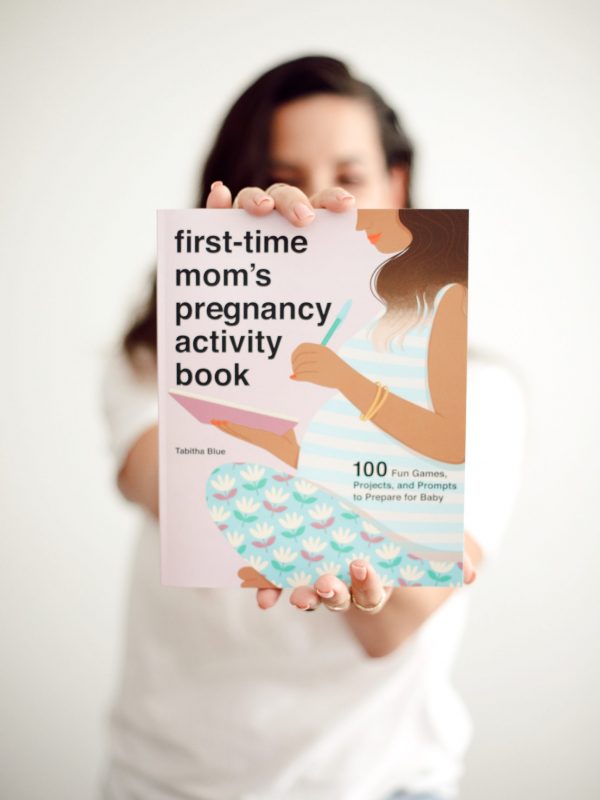 holding first time mom's pregnancy activity book