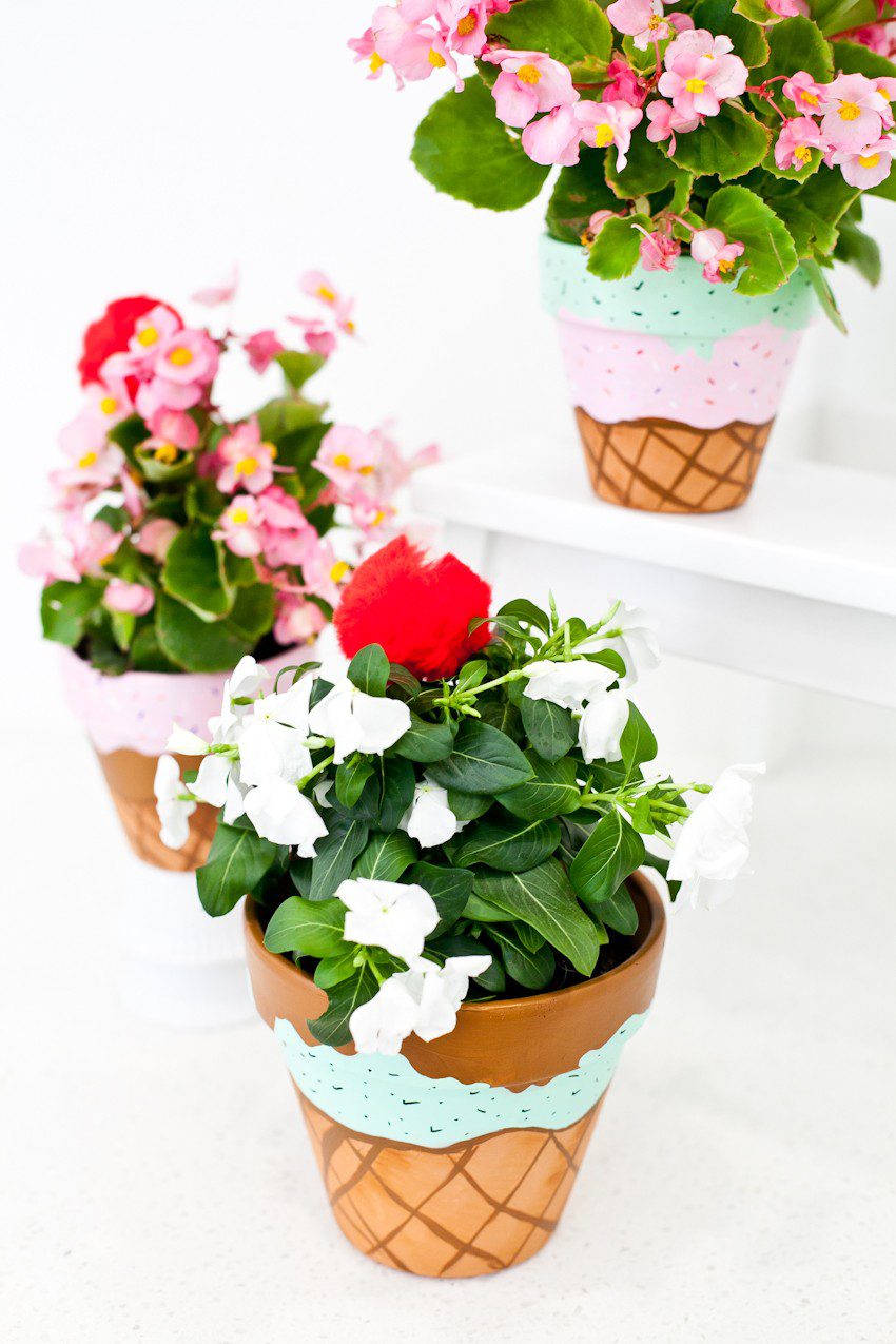 These fun Waffle Cone Ice Cream Painted Flower Pots are a simple to make and even topped with a cherry! Perfect for summer decor, an ice cream social or to satisfy your DIY sweet tooth by popular Florida lifestyle blogger Tabitha Blue of Fresh Mommy Blog.
