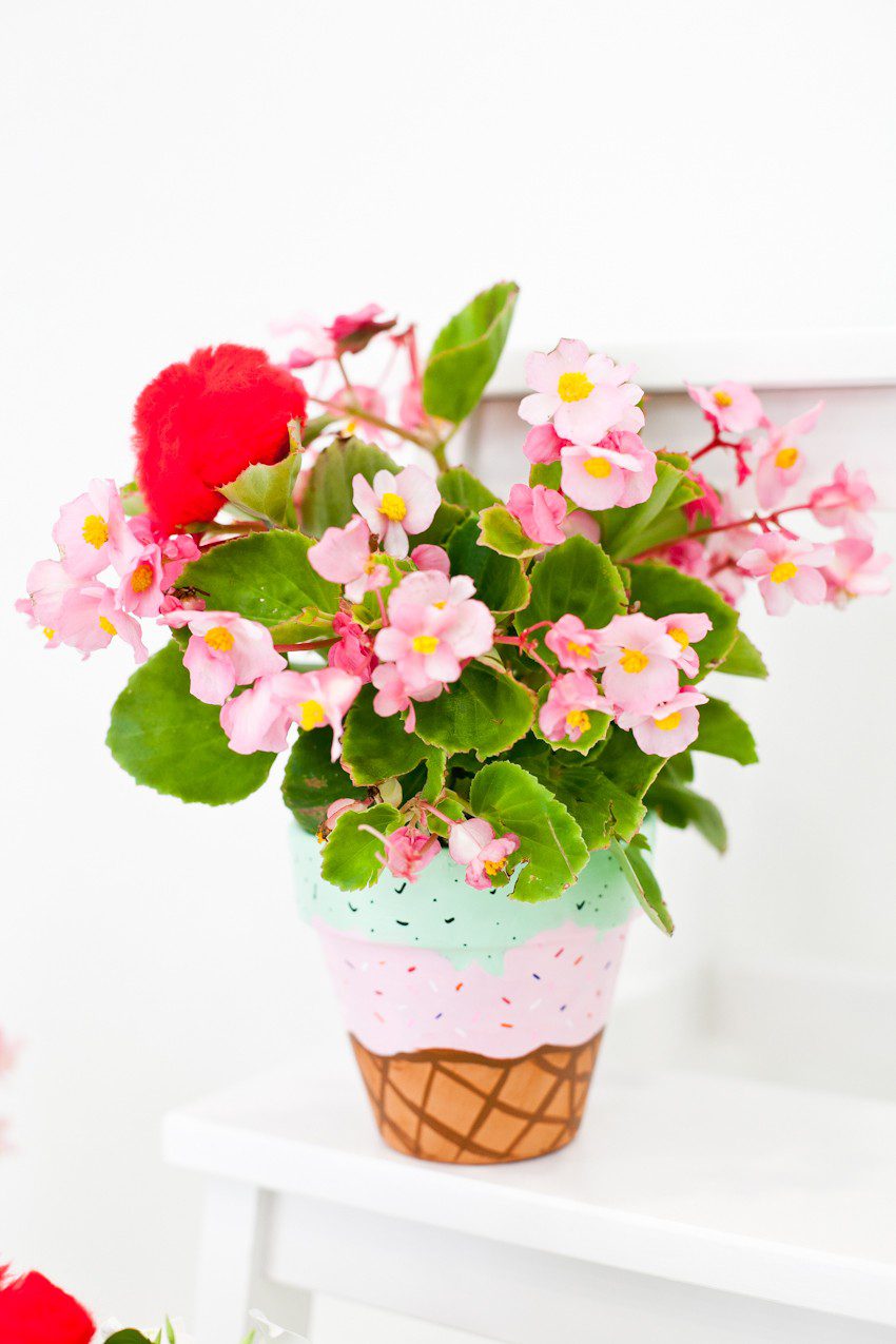 These fun Waffle Cone Ice Cream Painted Flower Pots are a simple to make and even topped with a cherry! Perfect for summer decor, an ice cream social or to satisfy your DIY sweet tooth by popular Florida lifestyle blogger Tabitha Blue of Fresh Mommy Blog.