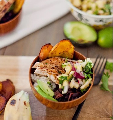 Caribbean Jerk Chicken Bowl with Pineapple Salsa and Fried Plantains for a flavorful dinner recipe idea featured by popular Florida foodie blogger, Tabitha Blue of Fresh Mommy Blog