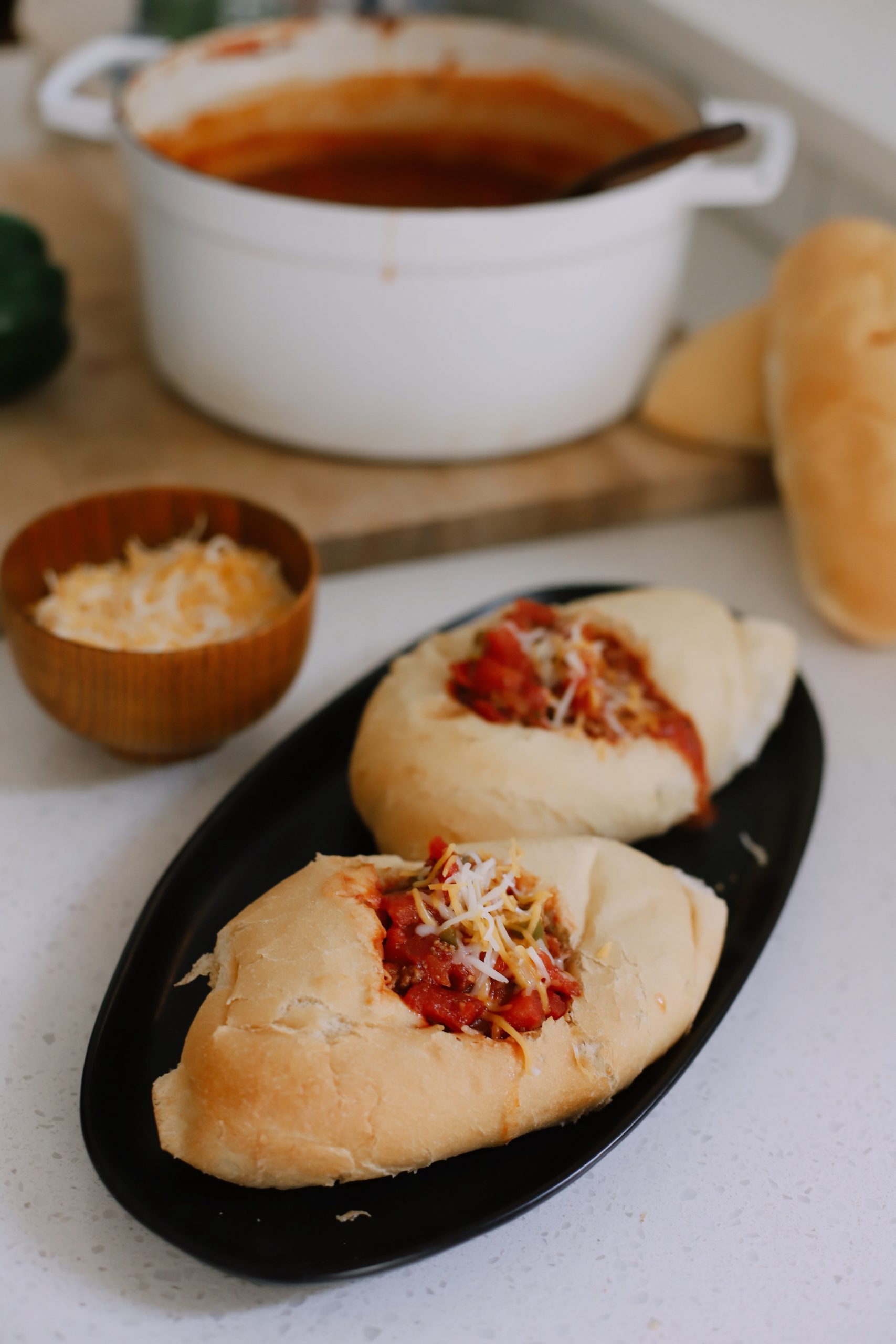 Easy Family Favorite Chili recipe! Make this delicious classic homemade chili in the crockpot or in one pot easily. It's THE BEST CHILI, and my family asks me to make it over and over. | Chili Recipe by popular Florida lifestyle blog, Fresh Mommy Blog: image of chili in bread bowls. 