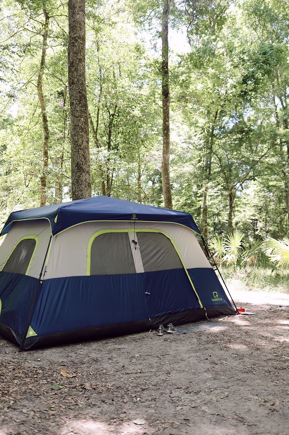 11 Camping Must Haves and Don't Bothers You Need to Know Before You Go. Family Camping | Camping Must Haves by popular Florida lifestyle blog, Fresh Mommy Blog: image of a blue and grey tent. 