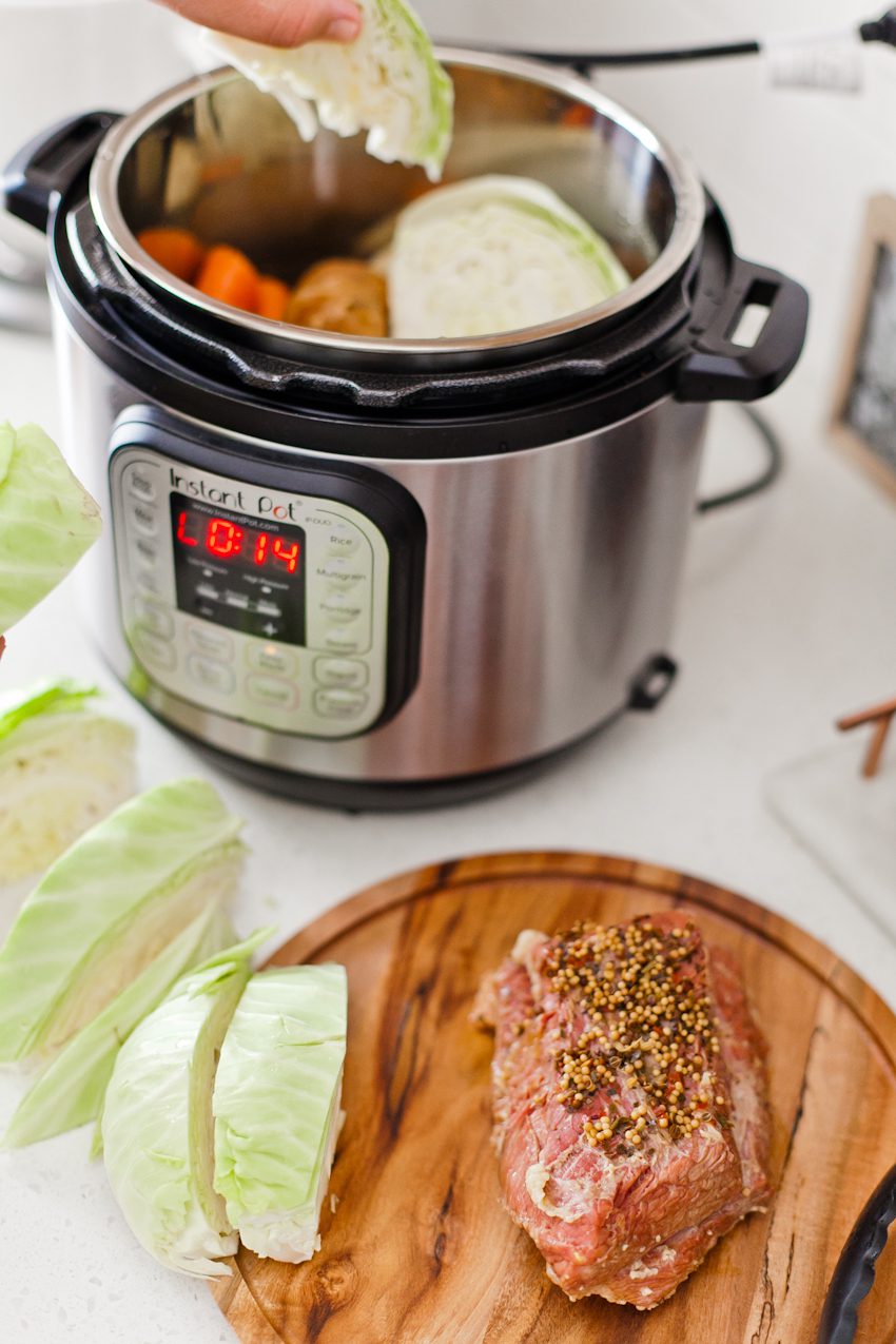Tender Instant Pot Corned Beef and Cabbage in guinness recipe by popular lifestyle Florida blogger, Tabitha Blue of Fresh Mommy Blog! This tender, beer-infused Instant Pot Corned Beef and Cabbage is the perfect way to celebrate St. Patrick’s Day and is easy to cook in less time.