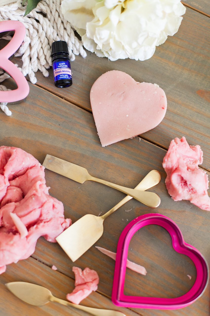 Easy Recipe for The Best Homemade Playdough with Essential Oils for Calming by top Florida lifestyle blogger Tabitha Blue of Fresh Mommy Blog. Change the colors and cookie cutters for any holiday. This pink is perfect for Valentine's Day or Easter!