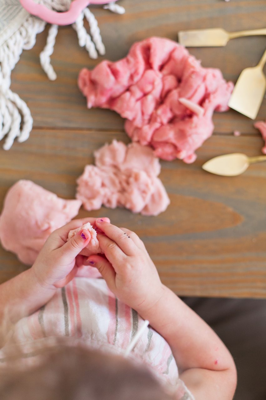 Easy Recipe for The Best Homemade Playdough with Essential Oils for Calming by top Florida lifestyle blogger Tabitha Blue of Fresh Mommy Blog. Change the colors and cookie cutters for any holiday. This pink is perfect for Valentine's Day or Easter!