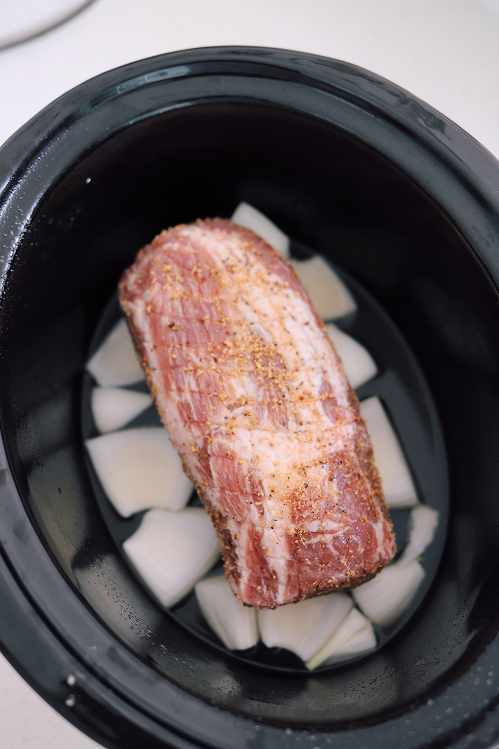 Slow Cooker Pork Roast Recipe - Incredibly Tender with Just Four Ingredients featured by top US blogger, Tabitha Blue of Fresh Mommy Blog