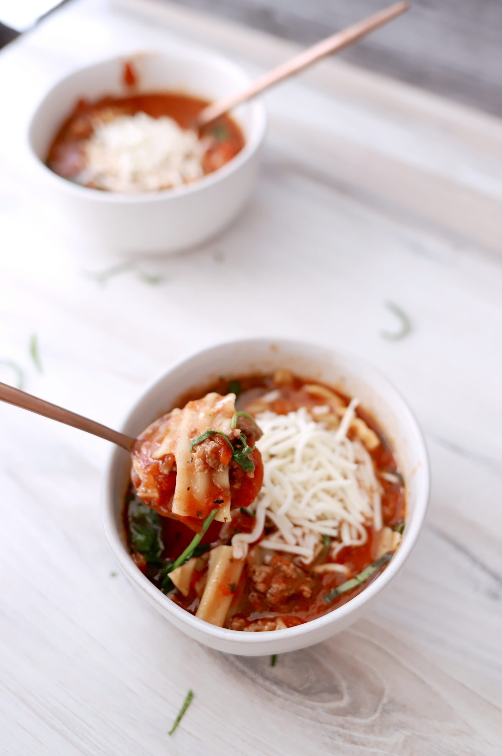 You have to try this Easy and Delicious Slow Cooker Lasagna Soup! A lasagna soup recipe that tastes just like lasagna but is easier to make and you can do it one pot or in a slow cooker. This is one of my favorite dinner recipes and I like it BETTER than traditional lasagna! #eatingonadime #crockpotrecipes #souprecipes #slowcookerrecipes