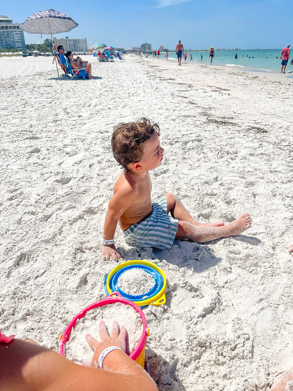 kids enjoying family friendly Florida beach with collapsible buckets
